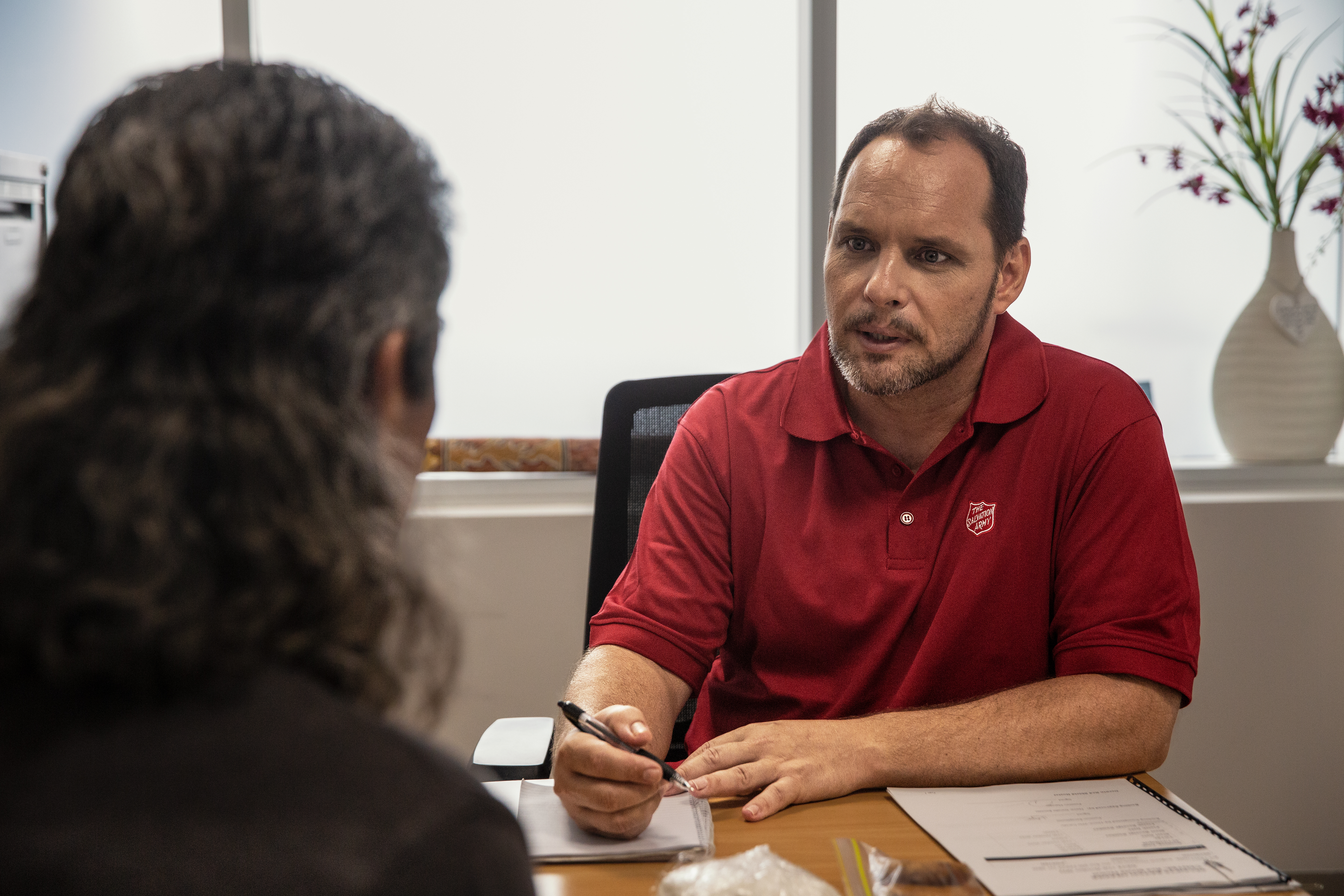 Two people speaking in an office
