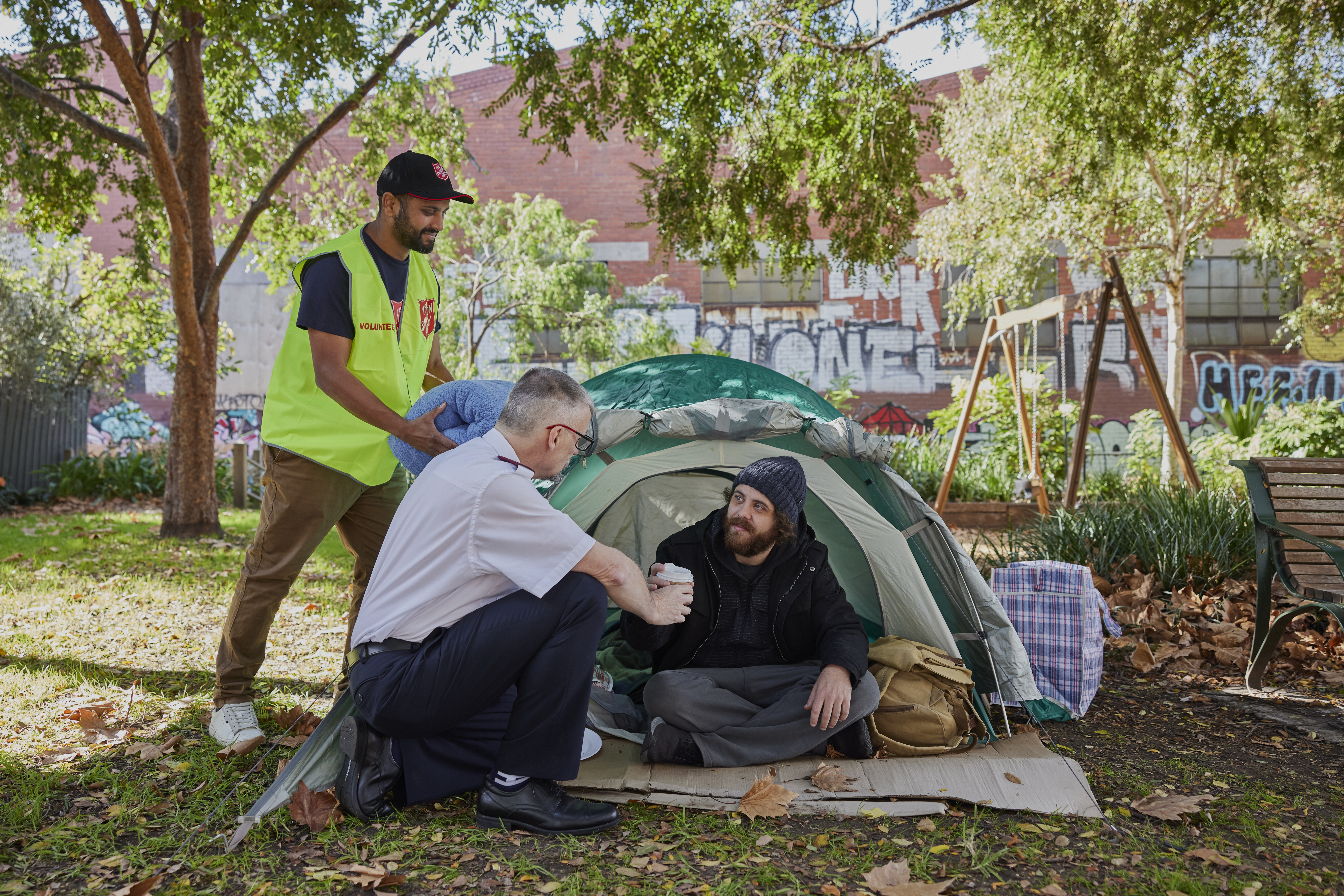 Salvos helping someone experiencing homelessness and living in a tent