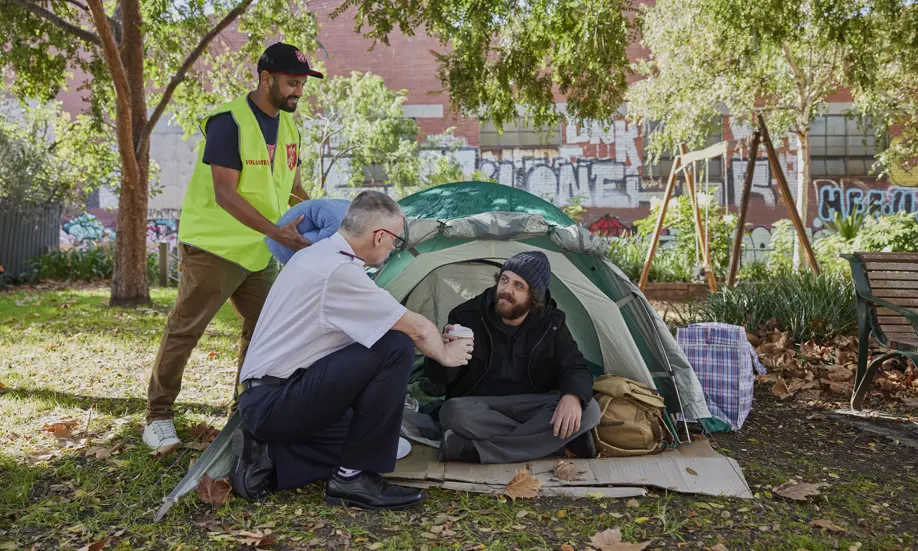 Salvos helping someone experiencing homelessness and living in a tent
